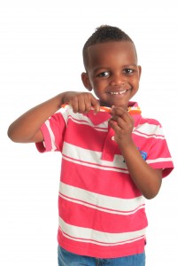 African american black child with a tooth brush isolated
