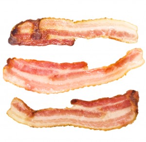 Close up of bacon strips isolated on white